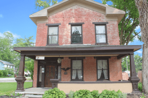Front View of 1 W Main St Spring Valley brick two story with mixed use