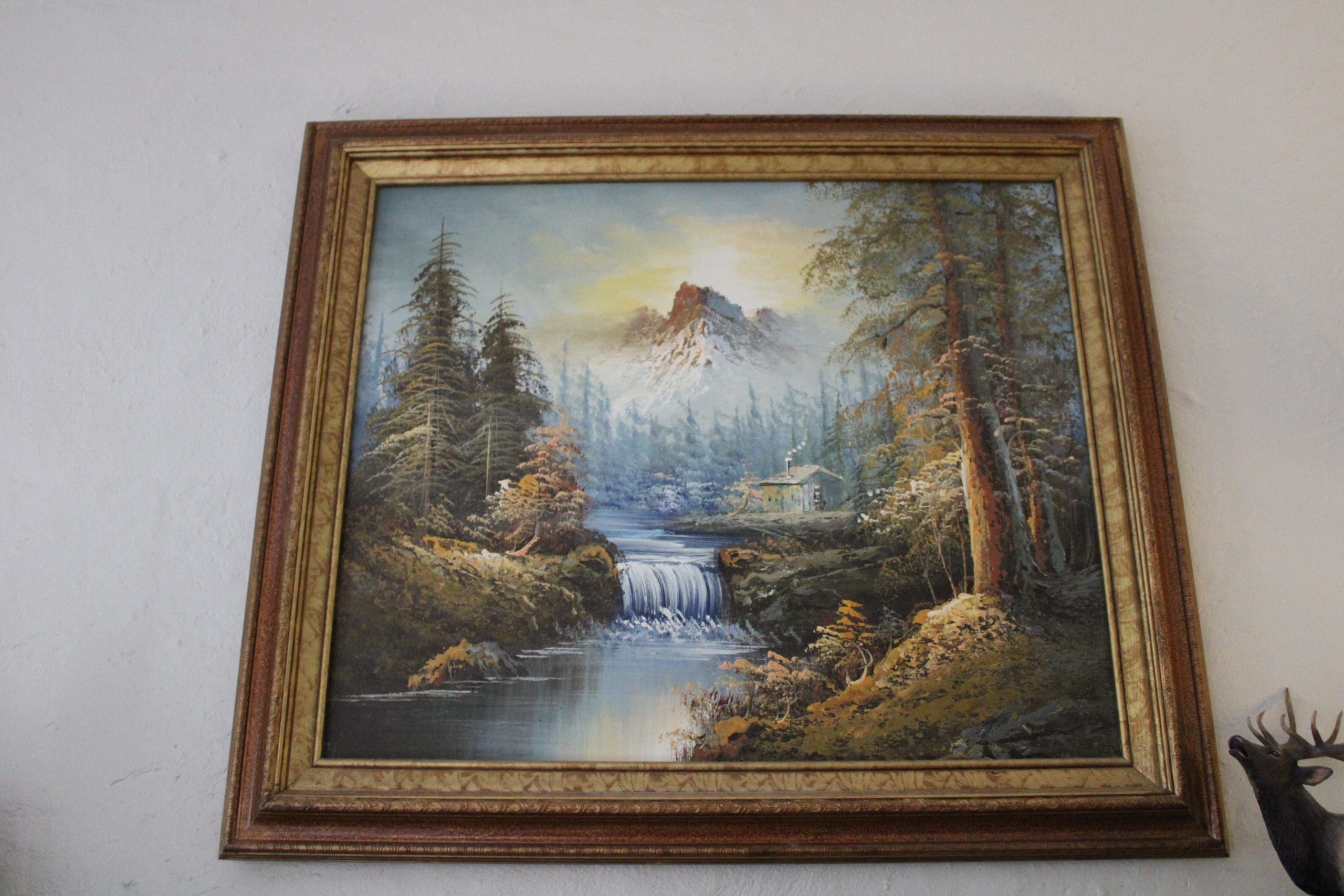 Framed painting of water, forest and mountains view for sale