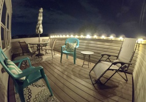 Talk about cozy and inviting! This rooftop deck at Night is even MORE AMAZING!