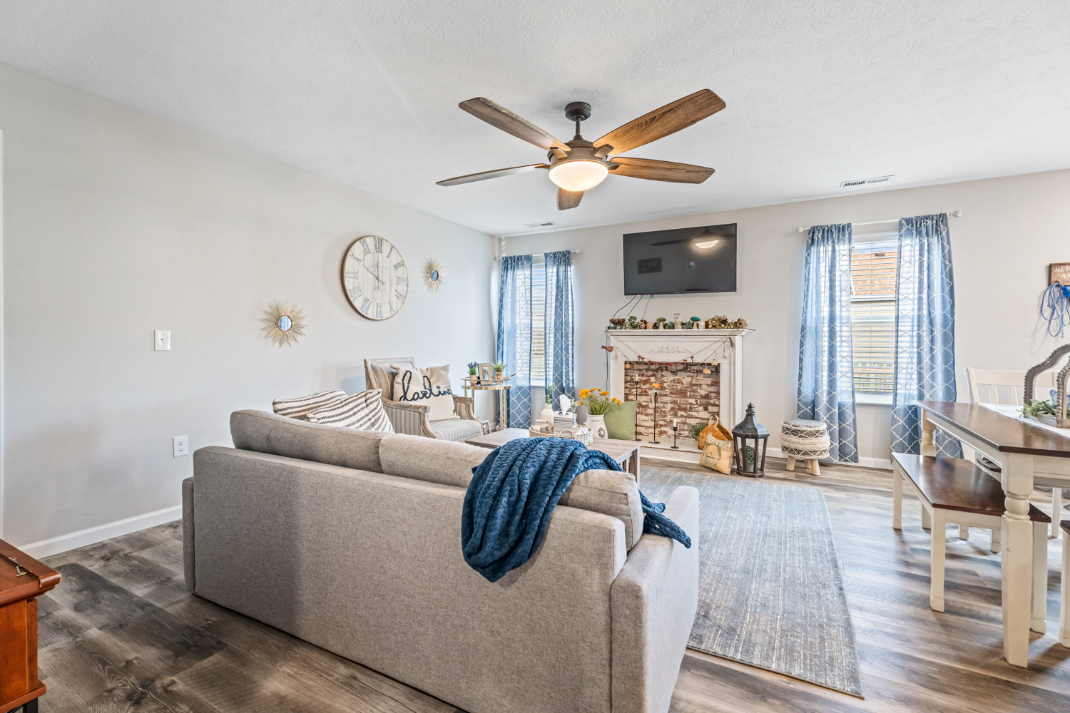 Open Living Room features faux fireplace and all the CHARM Open Living Room features faux fireplace and all the CHARM